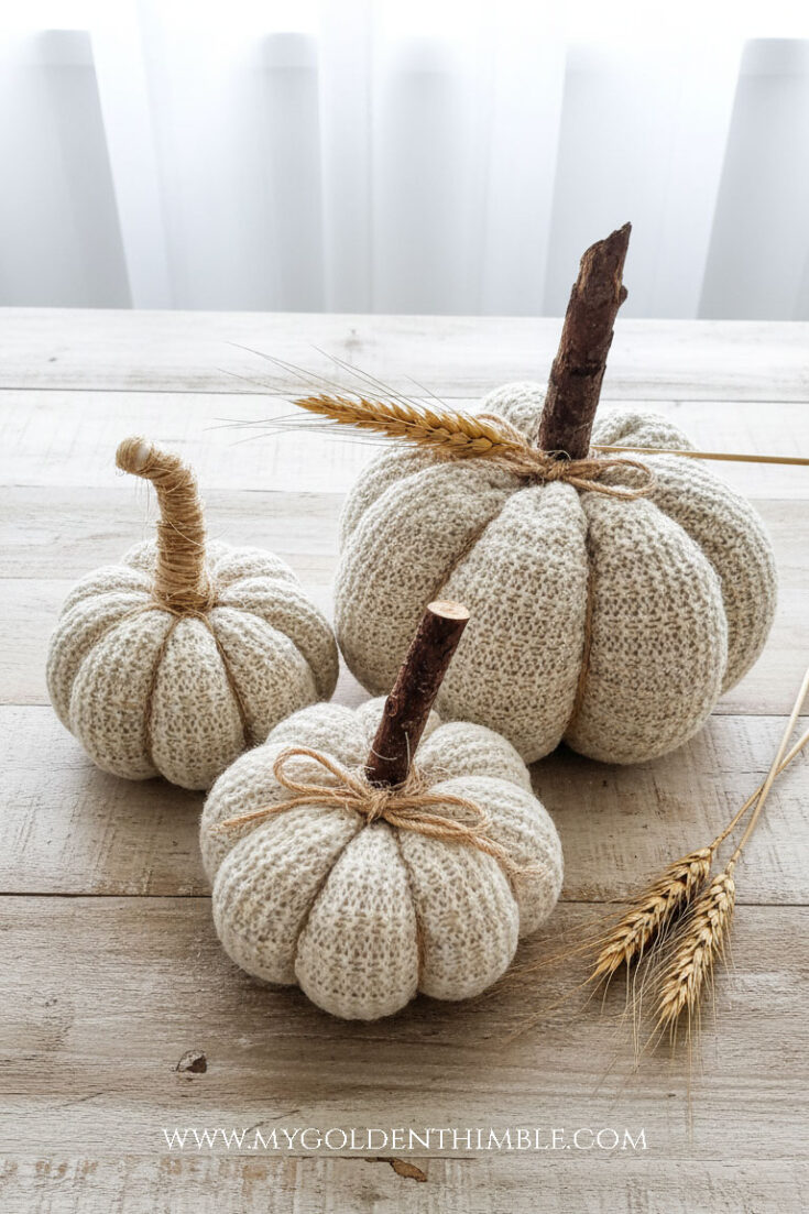 sweater pumpkins handmade on a wooden table
