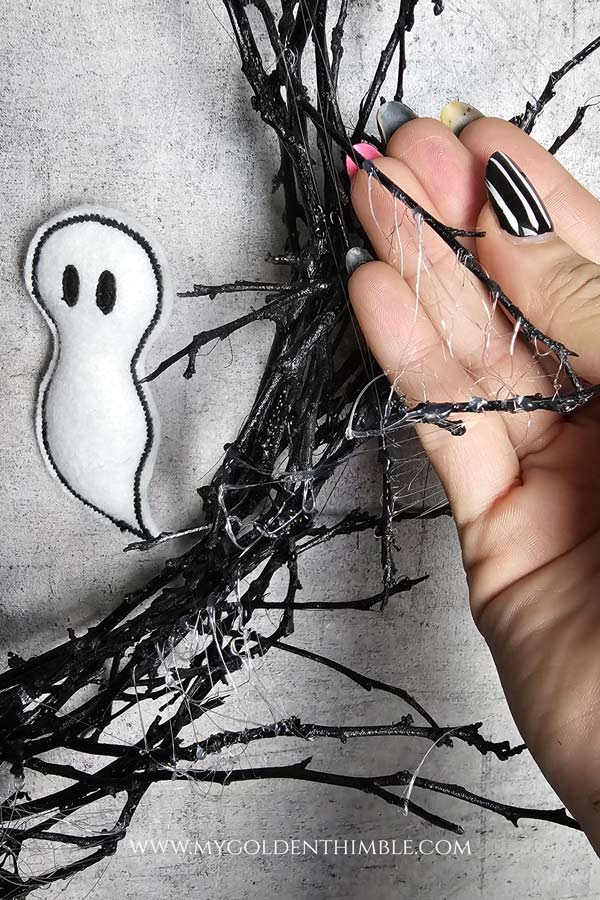 black branches with felt ghost