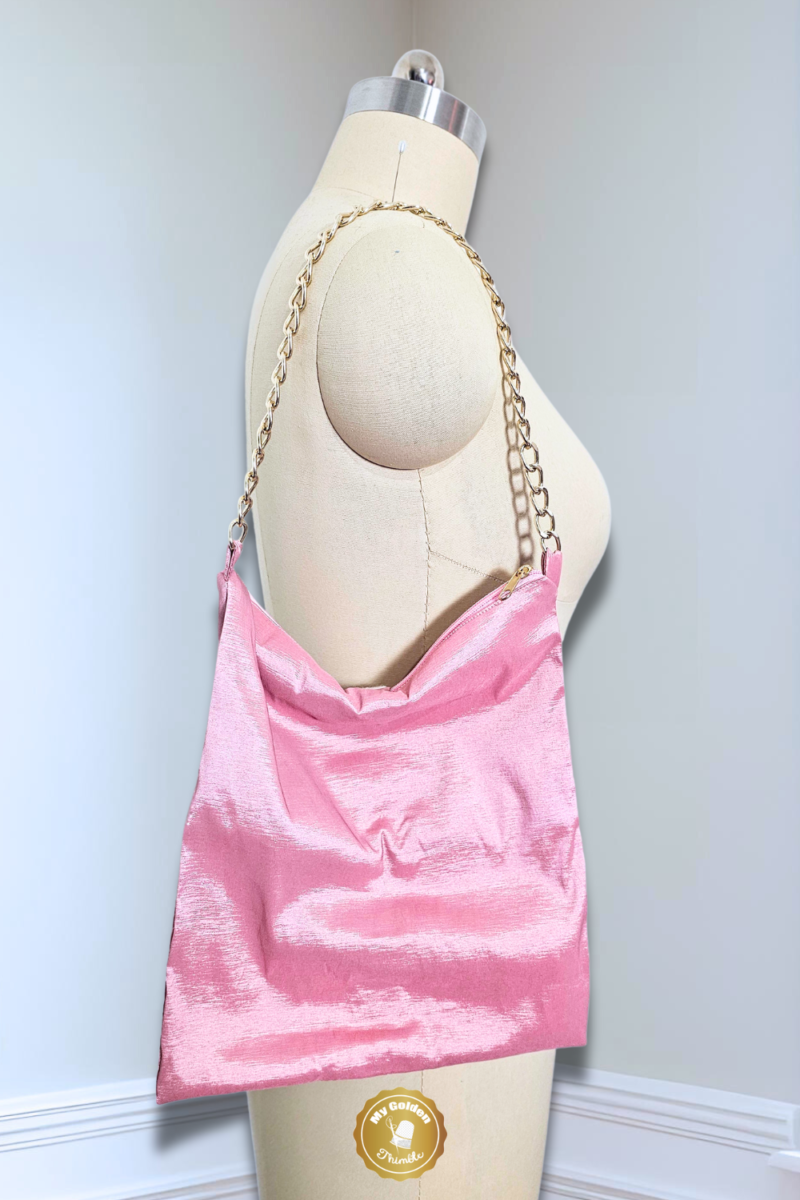 pink fabric bag on dress form