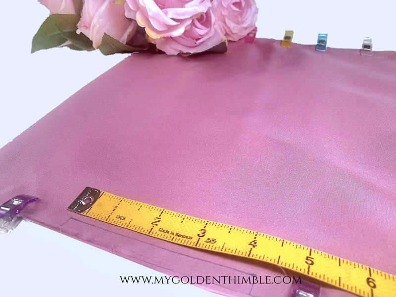 measuring tape above pink fabric