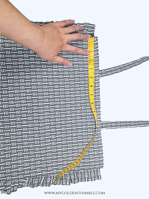 ruffled bag with a measuring tape on top