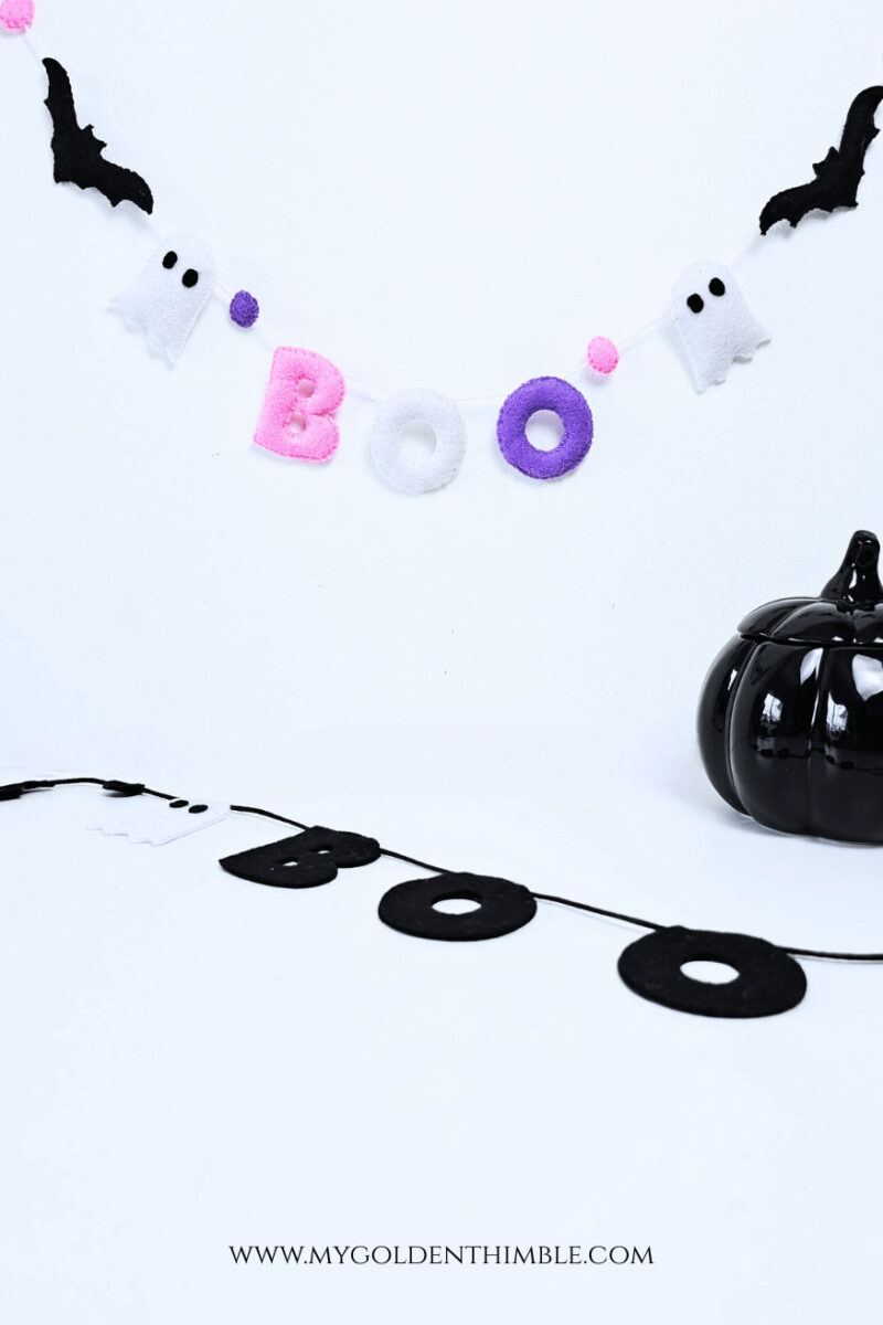 DIY Halloween garland in black and white felt, flat letters and bat shapes, sleek and classic Halloween décor.