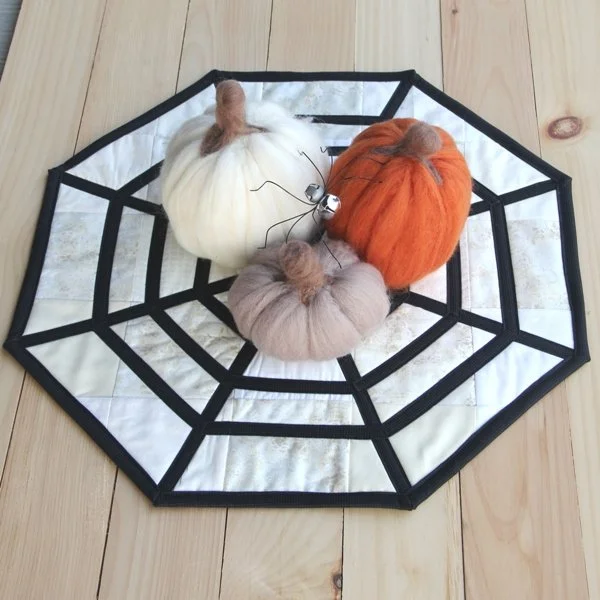 spider web table topper made with white fabric