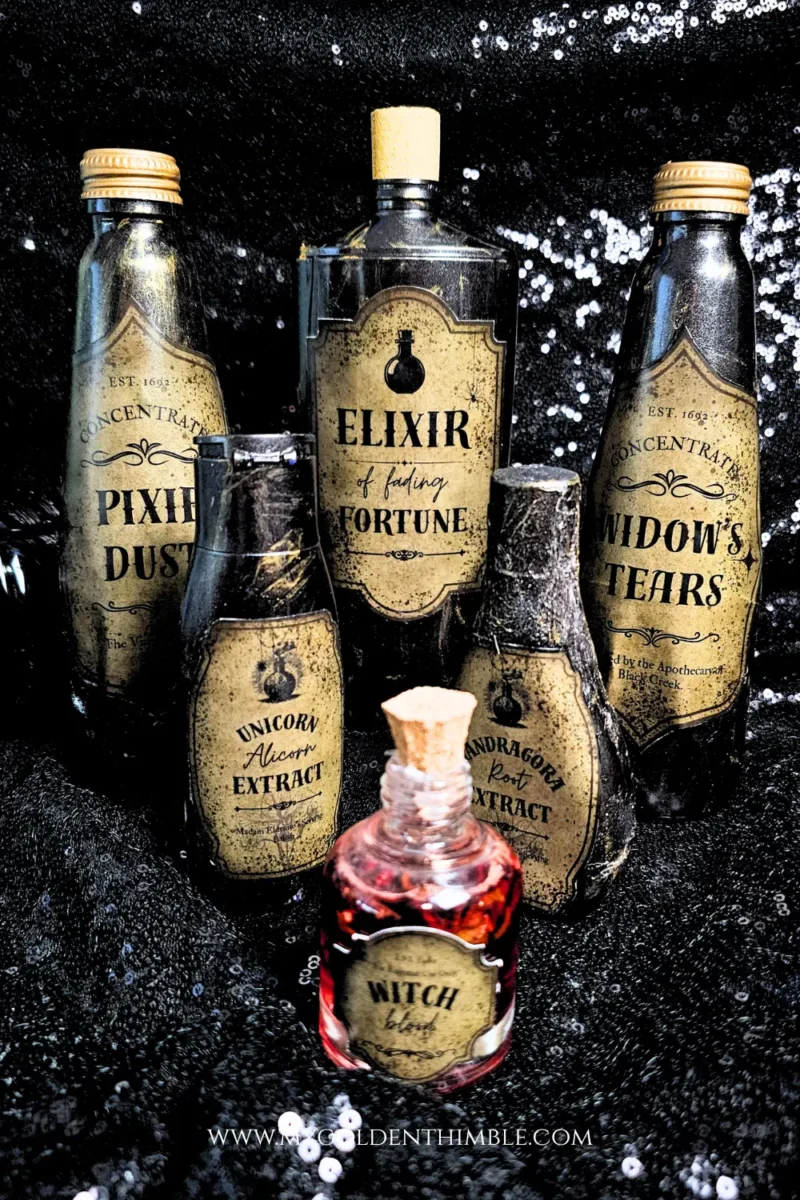 Set of DIY potion bottles from recycled bottles in various shapes and sizes, styled with free and premium printable labels for Halloween decoration.