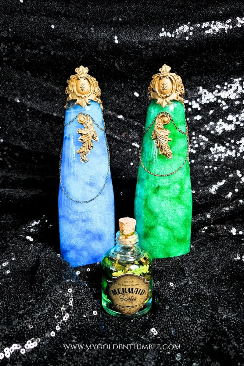 Mystique sparkling potion bottles filled with water, craft filling, glitter, and colorful dyes for a magical Halloween effect.