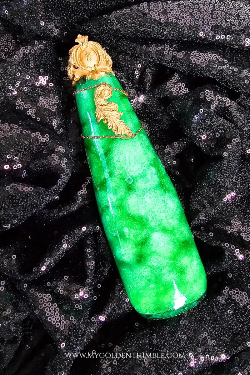 Mystique sparkling potion bottles filled with water, craft filling, glitter, and colorful dyes for a magical Halloween effect.