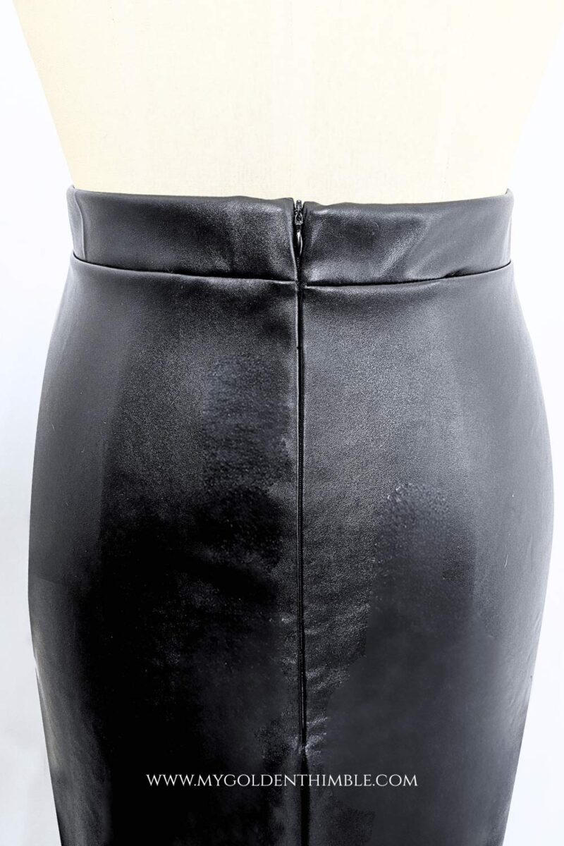 black leather skirt on a dress form seen from the back