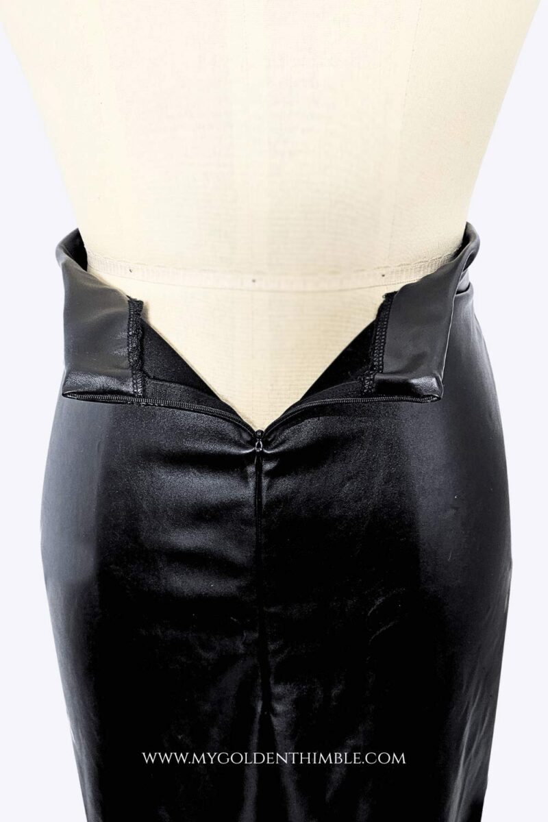black leather skirt on a dress form seen from the back