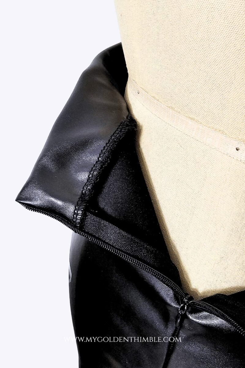 black leather skirt on a dress form seen from the back