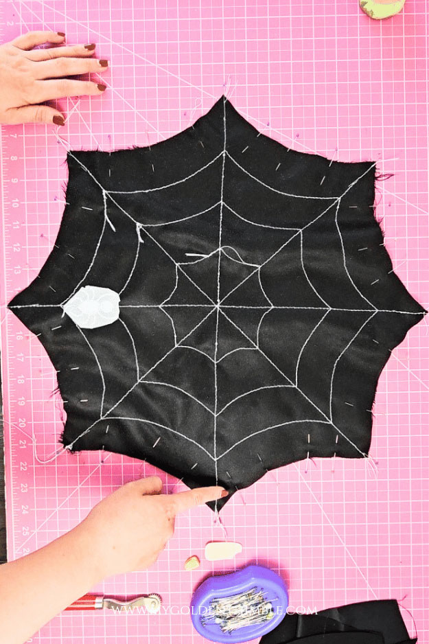 process of sewing a spider web pillow