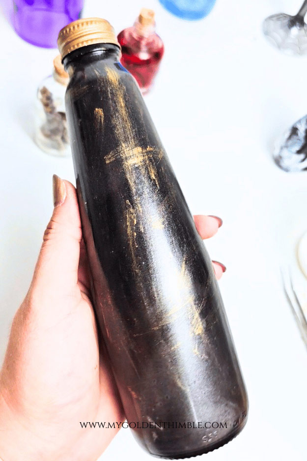 close up of dry brushing a bottle