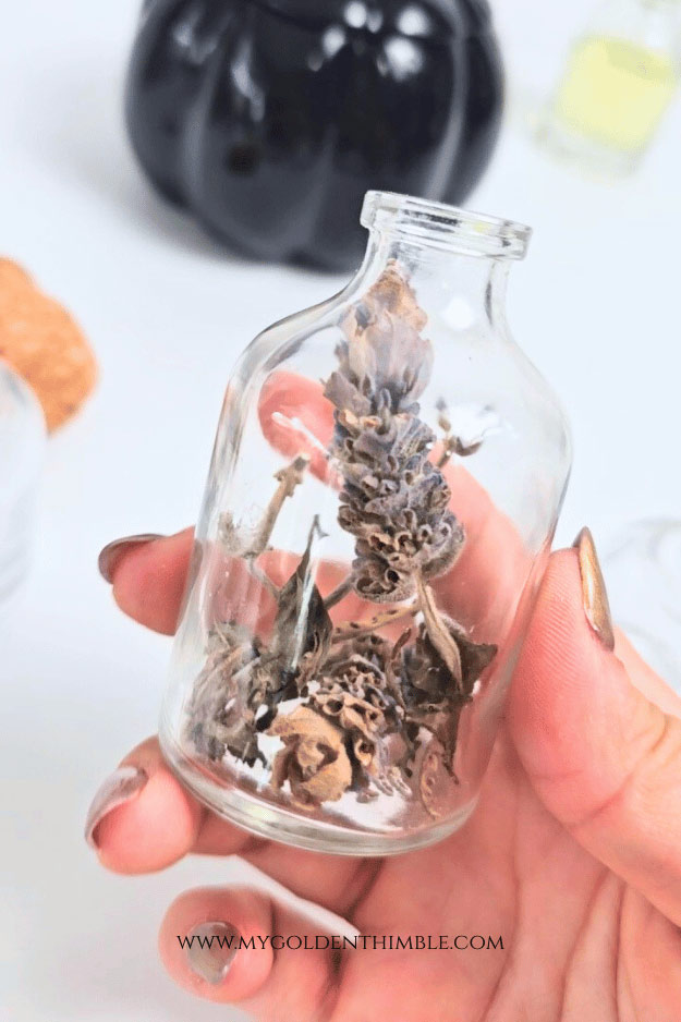 close up of a bottle with lavander inside