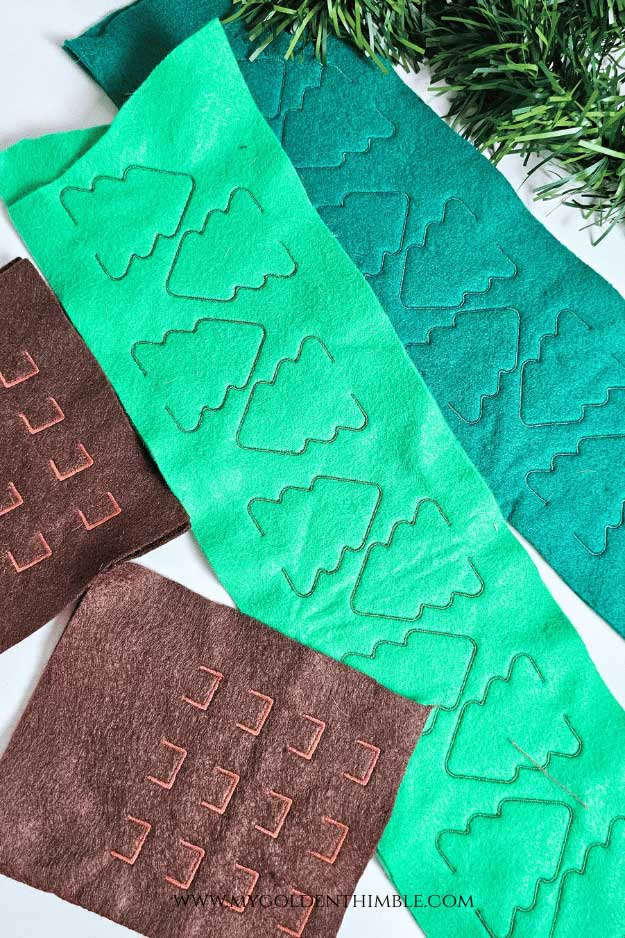 Embroidery machine stitching two felt trees for the Tree Felt Christmas Garland DIY.