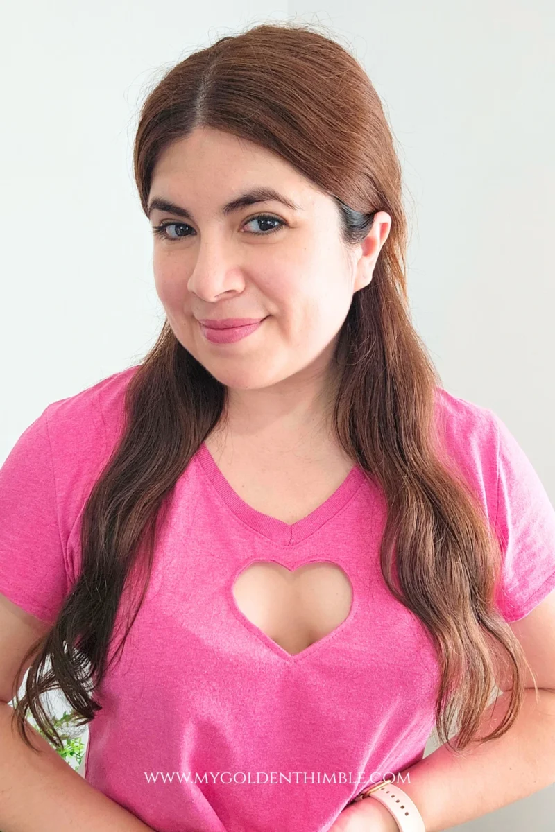 tyle photo of woman modeling heart cut out T-shirt