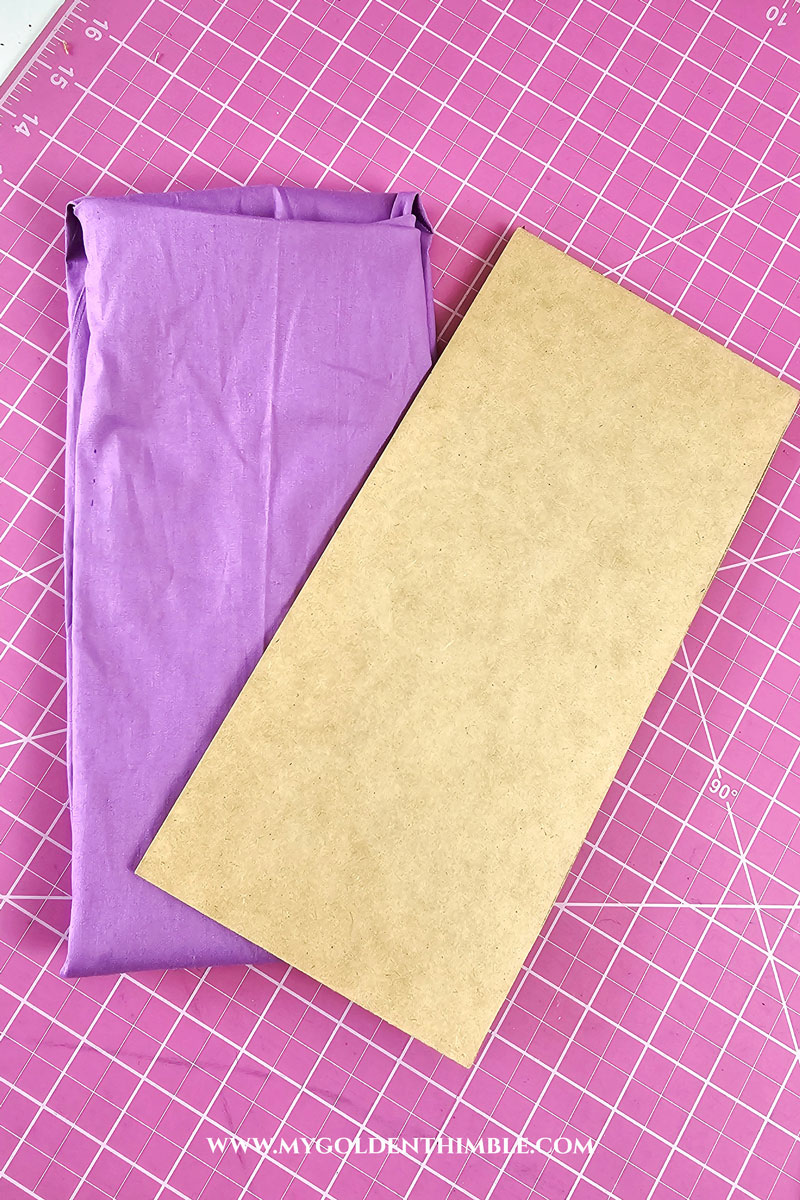 how to fold fabric to organize it using a chipboard