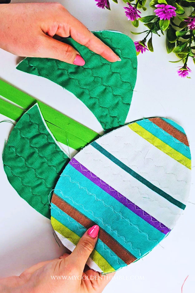 Quilting the potholder pieces with decorative stitches on a sewing machine