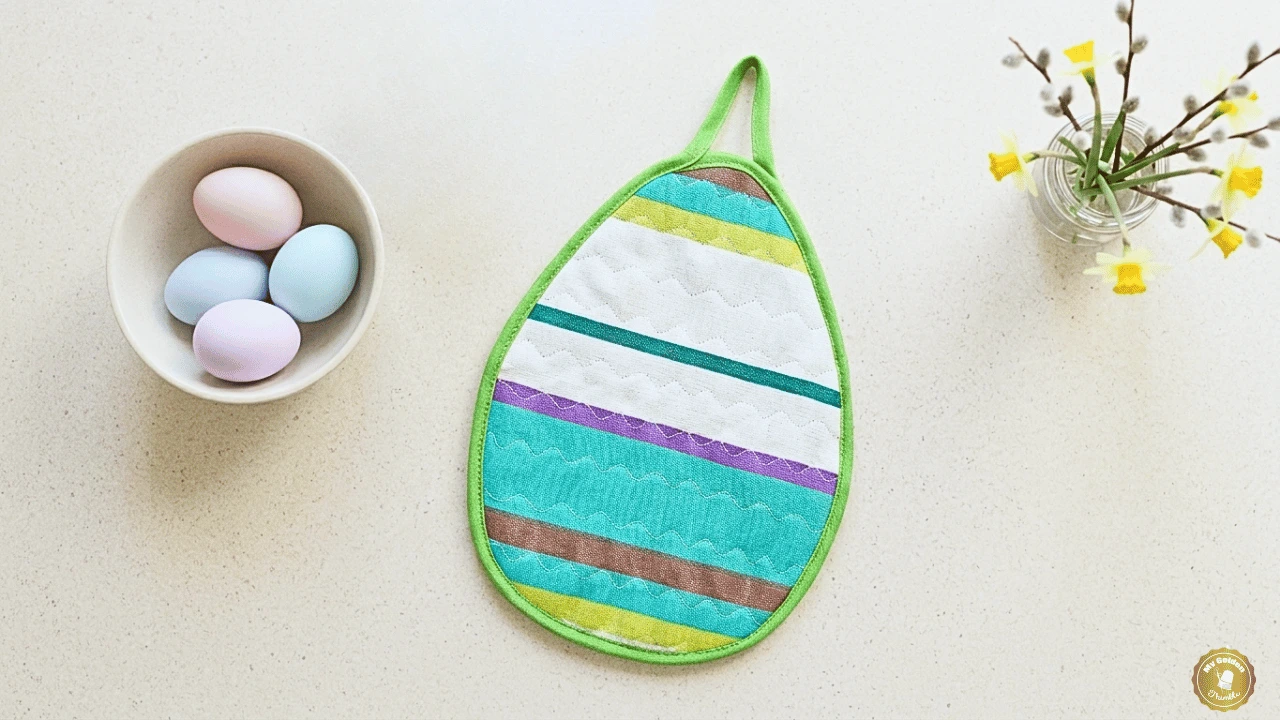 Quilted Easter egg potholder with decorative stitches