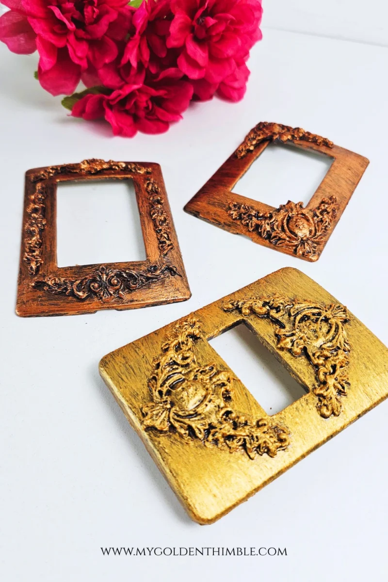 Decorative vintage light switch cover with ornate flourish details