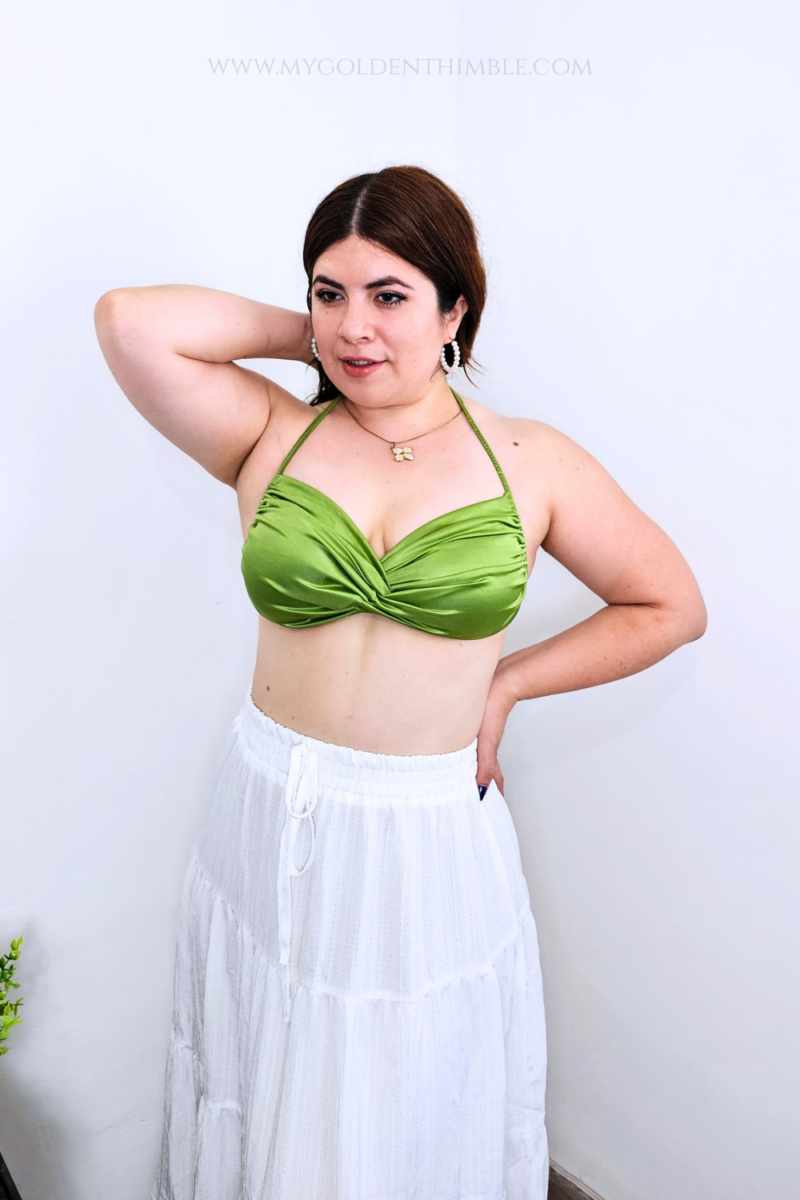 Model wearing the finished Buttercup Bikini Top with a twisted front and gathered details.