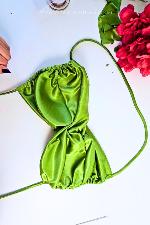 Threading the spaghetti strap through the fabric channels with a loop turner.