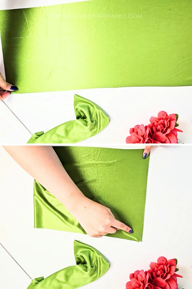 Folding the bikini top rectangle in half with right sides together.