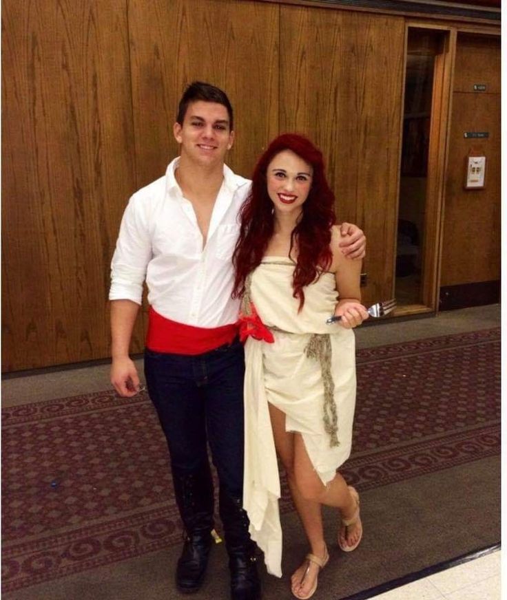 Erick and Ariel Costume DIY from the little mermaid. Erick is wearing a white dress shirt with a red belt and ariel is wearing the muslin dress tied with a rope