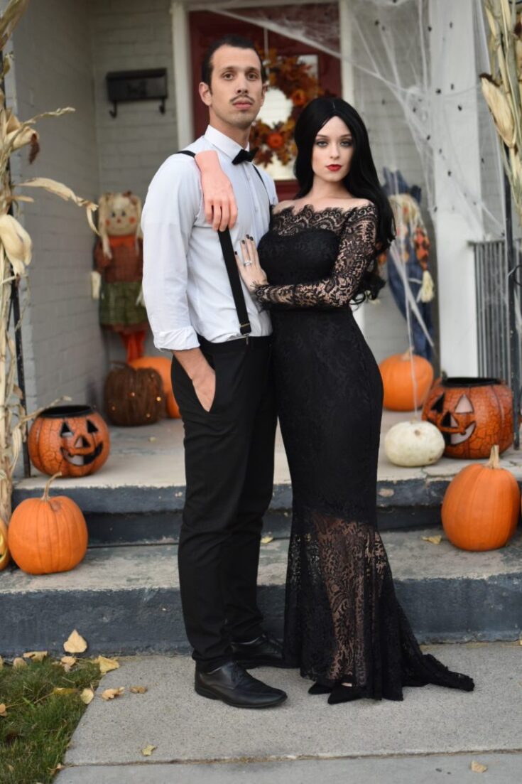 couple wearing a DIY gomez and morticia adams costume