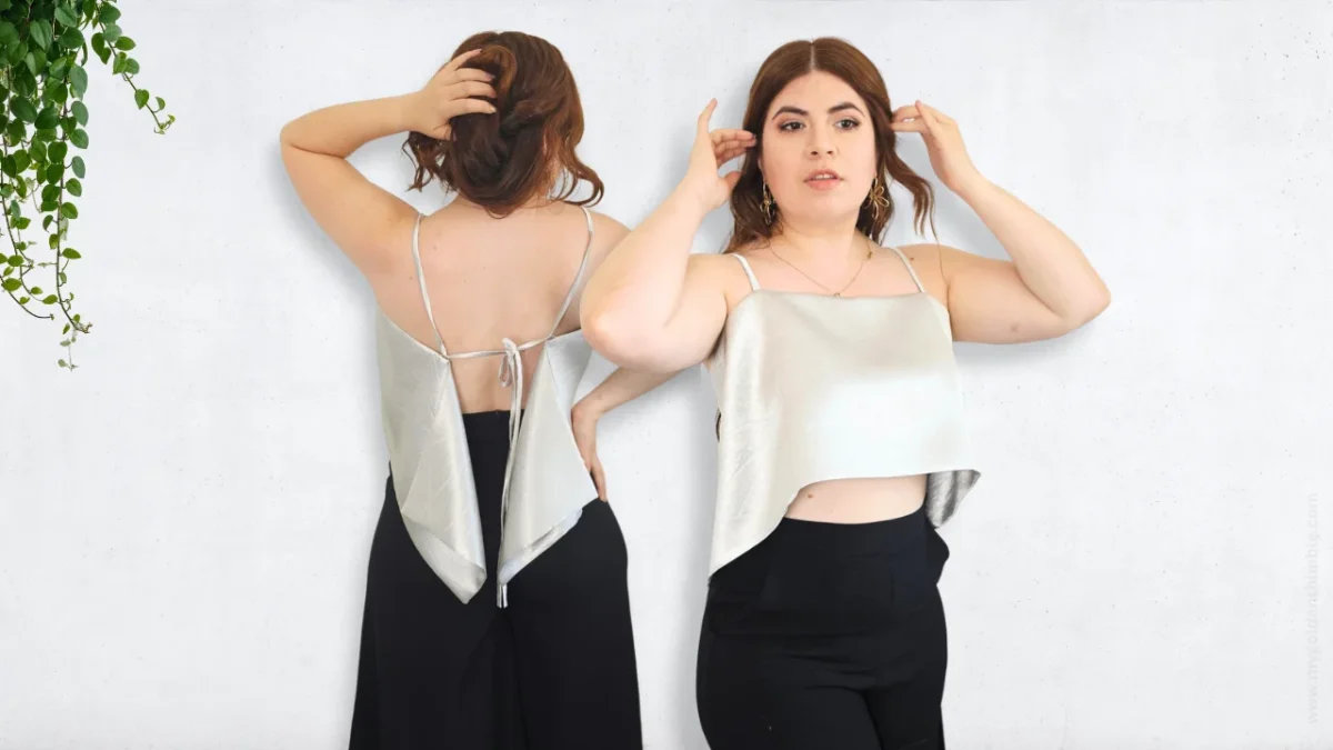 Woman wearing a silver diy rectangle top pattern with black pants