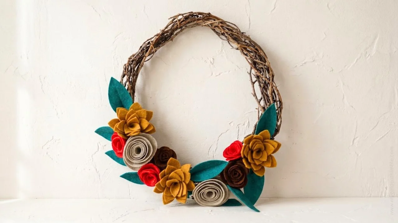 Finished felt flower wreath made with colorful rolled felt flowers and leaves