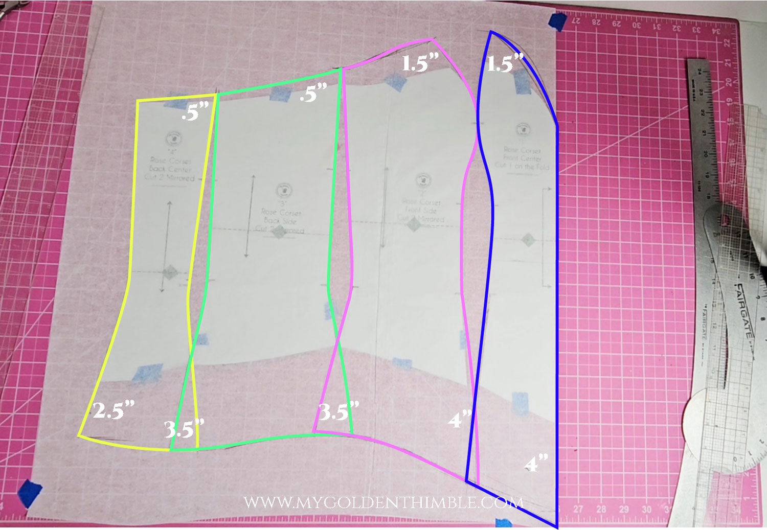 Sewing pattern pieces laid out with colored lines indicating adjustments for a custom burlesque corset project.