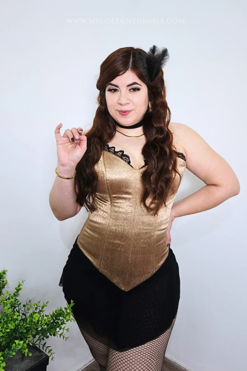 Full-body view of a woman posing playfully in a handmade burlesque girl Halloween costume.