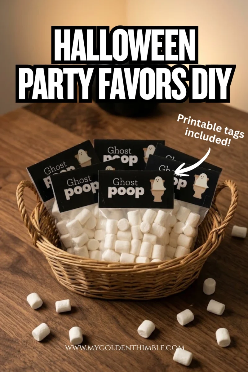 A woven basket filled with handmade Halloween 'Ghost Poop' treat bags filled with mini white marshmallows, arranged on a dark wooden table next to a black pumpkin and scattered marshmallows.